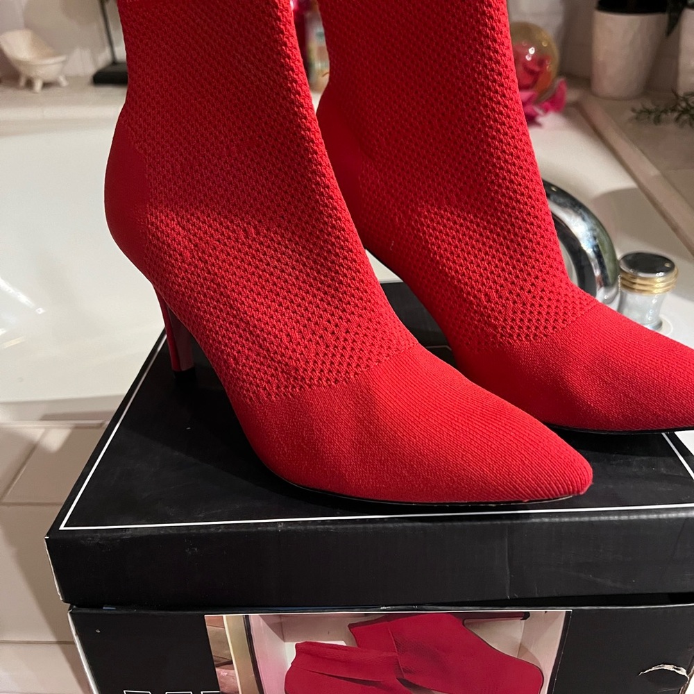 Red high heel boots by Mia.